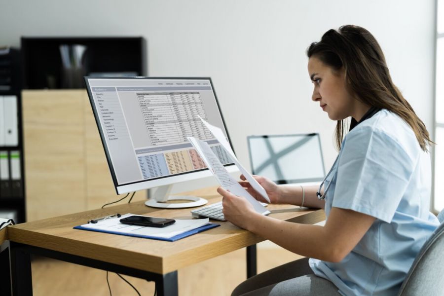 nurse review medical chart at detox center